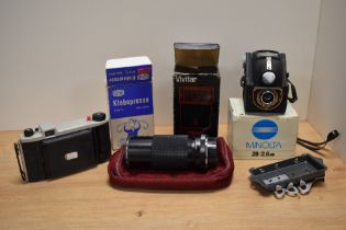 A collection of camera equipment, Minolta 28/2.8 MD lens, Vivitar flash, vintage Kodak camera etc.