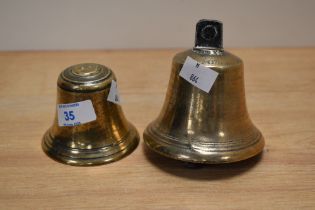 Two vintage brass bells, one with impressed 14oz mark to top.