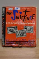 A Stanley Gibbons 'The Swiftsure expanding stamp album', housing a a variety of stamps.