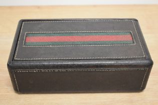 A Mens Gucci stitched leather jewellery or watch box, with green and red band to top, sliding lid