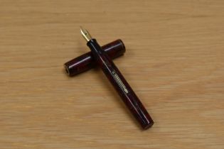 A Waterman 92 V lever fill fountain pen in red gold marble having Waterman Ideal Canada lid. Clip