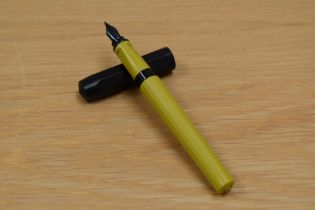 A Kaweco Perkeo cartridge fill fountain pen in indian summer with black cap having Kaweco Germany