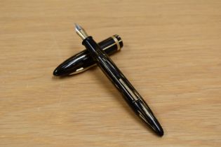 A Sheaffer Lifetime 500 lever fill fountain pen in brown striated design having Sheaffer feather