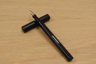 A Typhoo Tea lever fill fountain pen in chased BHR having warranted 14ct nib.