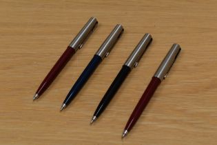 Four Parker 15 ballpoint pens black, blue, red and burgundy.