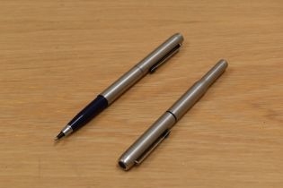 A Parker 25 cartridge fill fountain pen and rollerball set in brushed steel.