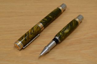 A boxed handmade converter fill fountain pen and rollerball set in green onyx with silver and gilt