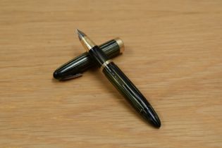 A Sheaffer Tuck Away plunger fill fountain pen in marine green striated design having military