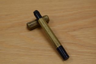 A gilt metal overlaid safety fountain pen having retractable Stilo Extra 22/4 nib. Poor condition.