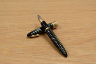 A Sheaffer Valliant Tuck Away plunger fill fountain pen in marine green striated with military