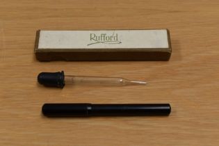 A boxed Rufford Ink Pencil in black having original paper instructions and eyedropper filler.