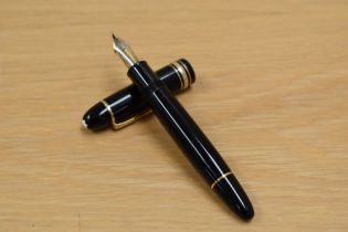 A boxed with papers Montblanc Meisterstuck 149 twist fill in black with gilt trim having a 1810