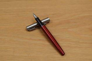 A boxed Parker Jotter cartridge fountain pen in Kengsington red with brushed steel cap having Parker
