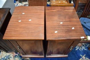 A pair of late Victorian mahogany pedestal cupboards having later tops, with approx 41cm.