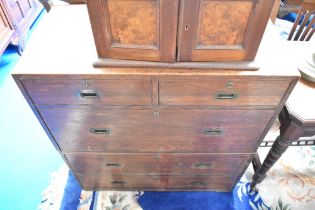 A 19th century oak campaign style chest, of two over three drawers, having typical concealed drop