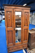 An early 20th century oak wardrobe of shallow proportions with mirrored door, dimensions approx