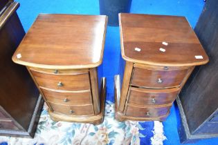 A pair of vintage hardwood beside drawers.