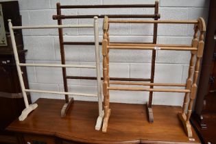 Three traditional wooden towel rails.