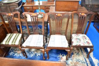 A set of Four Edwardian mahogany dining chairs.