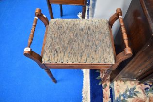 A Victorian mahogany upholstered piano stool.
