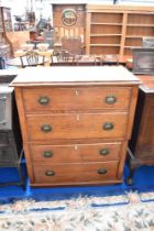 A 19th century oak chest of four long drawers having Arts and Crafts style handles (Splits in two,