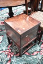 A 19th Century mahogany cellarette on legs