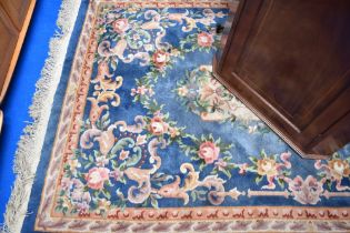 A Chinese rug having blue ground and multi coloured foliate decoration, approx 148 x 245cm