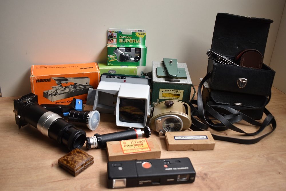 A box of various photographic itemsincluding film splicers, slide duplicator, Ilford Lantern