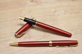 A Parker Sonnet converter fill fountain pen and ballpoint pen in Ruby red lacque