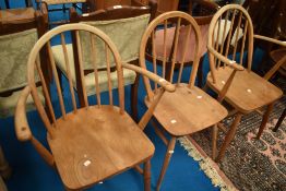 A set of three (two plus one) Ercol hoop and stick back kitchen chairs