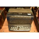 A vintage Schlossinetrel button accordion , sold with later accordion case (German)
