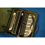 A vintage Baby Grand piano accordion, with case