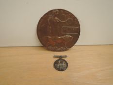 A British WWI War medal and Memorial Plaque to 26588 DVR.H.D.BALDWIN.R.A, plaque named HARRY DUXBURY