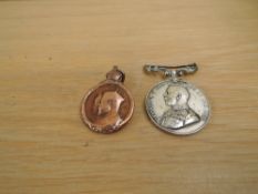 A George V Long Service and Good Conduct Silver Medal, type A, Swivel Suspender 1911-1920 named to