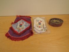 A metal decorated oval box with Kings Own embroidered Lion on lid along with two Lancashire