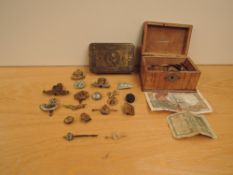 A Queen Mary 1914 Christmas Tin with Cap Badges, two Sweetheart Brooches one is 9ct Gold Medical