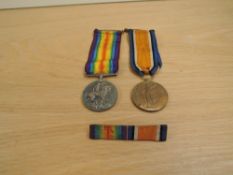 A WWI Medal Pair, War & Victory both to 166557GNR.G.ARMSTRONG,R.A, noth with ribbons