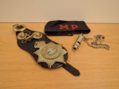 A MP (Military Police) 1949 Cloth Armband, black with red lettering along with a Hudson & Co Whistl
