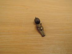 A brass Fumsup Doll having movable arms, wooden head, WWI period given to WWI soldiers as a lucky