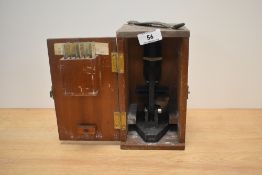 A vintage Britex Minor 2037 students microscope, cased with seven sample slides, used with scratches