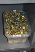 A large collection of vintage glass marbles, of traditional form with a variety of coloured internal