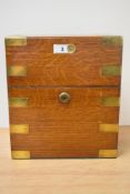 A good quality Victorian brass-bound light oak decanter box, of hinged oblong form with brass
