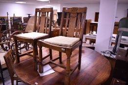 Four mid 20th Century oak dining chairs