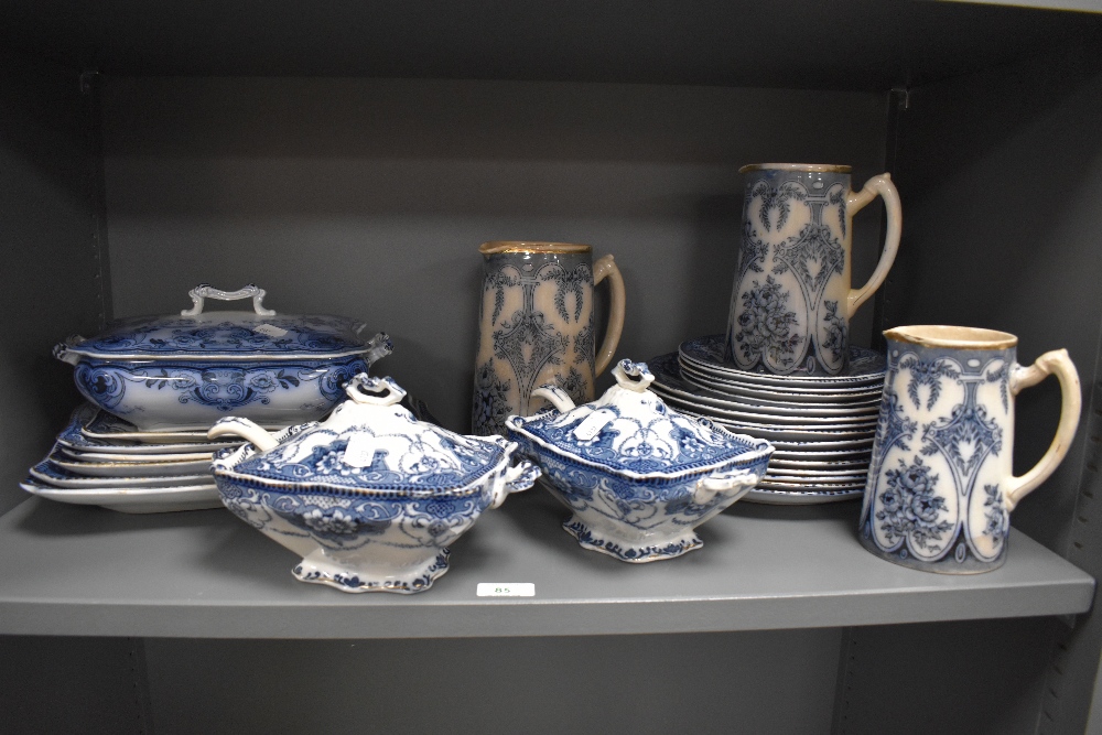 A selection of 19th/20th Century blue and white ironstone tableware, including lidded soup