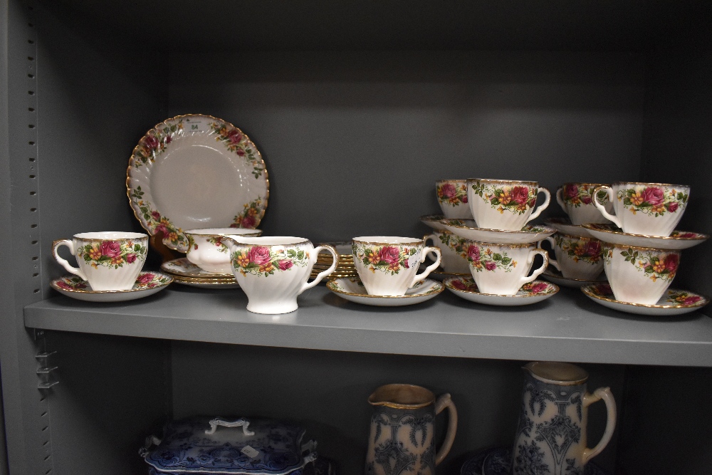 A selection of Washington pottery 'English Rose' patterned teaware, including teacups and saucers
