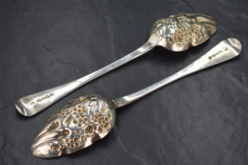 A pair of George IV silver berry spoons, of traditional form having embossed decoration to the - Image 2 of 3