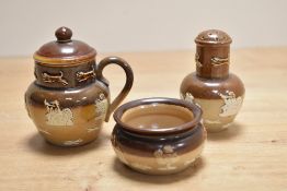 A 19th Century Doulton Lambeth stoneware three piece cruet set, to comprise a lidded mustard pot,