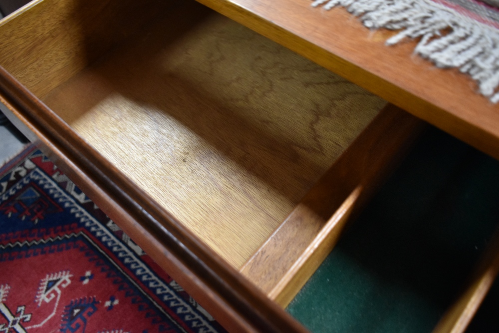 A vintage teak sideboard having three central drawers, flanked by cupboards, width approx. 179cm - Image 3 of 3