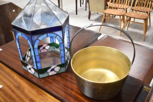 A traditional jam pan and coloured glass terrarium