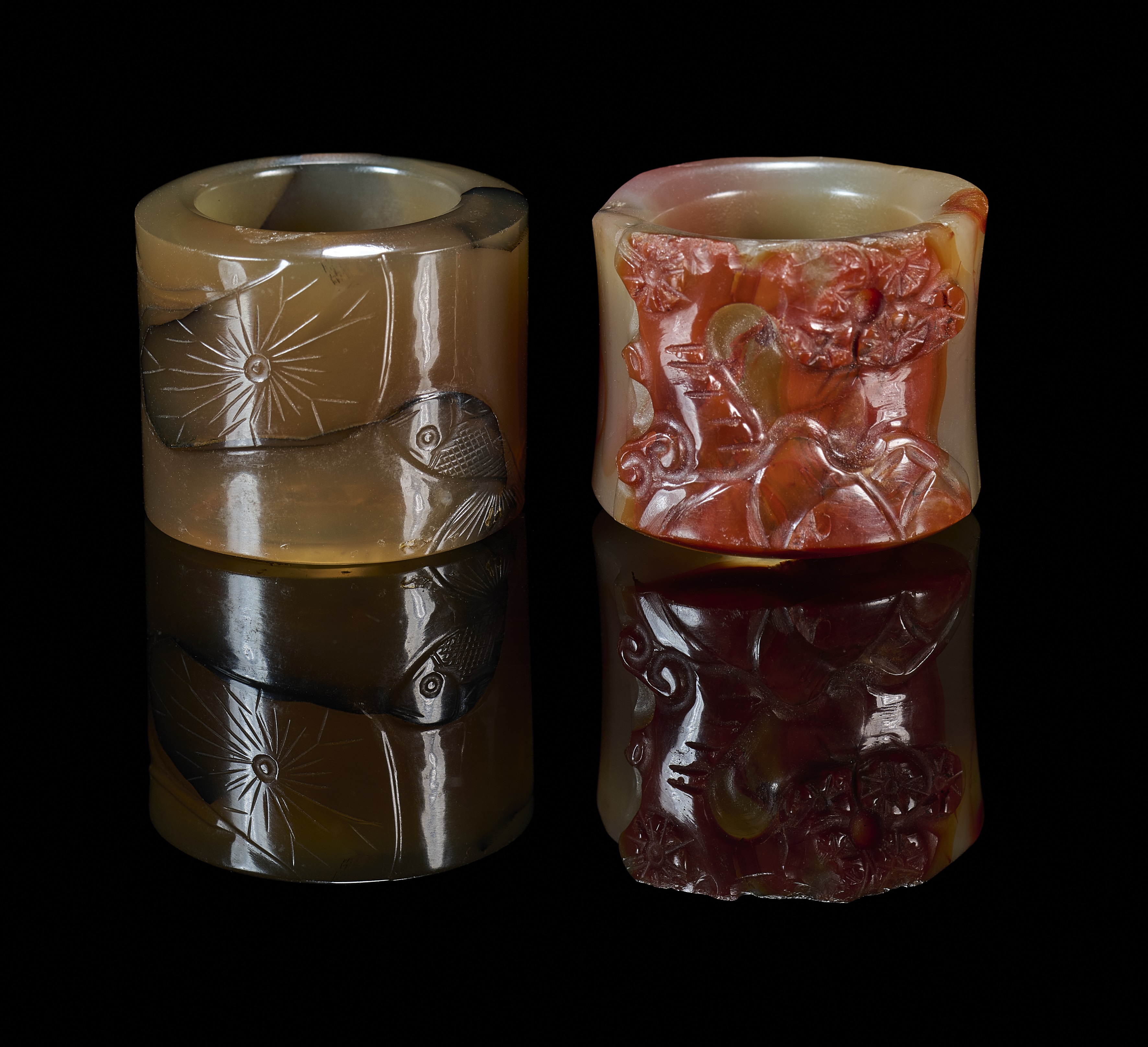 TWO CHINESE CARVED AGATE ARCHERS RINGS, QING DYNASTY, 19TH CENTURY